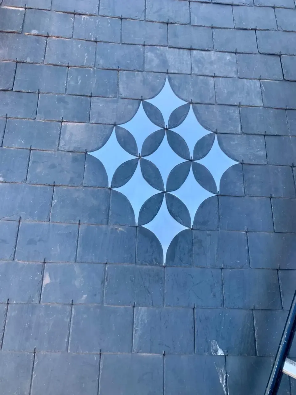 Decorative slate patterns, metal surrounds and masonry connections.
