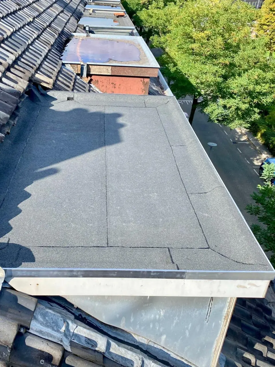 Roofing membranes, upstands and connections around rooflights.